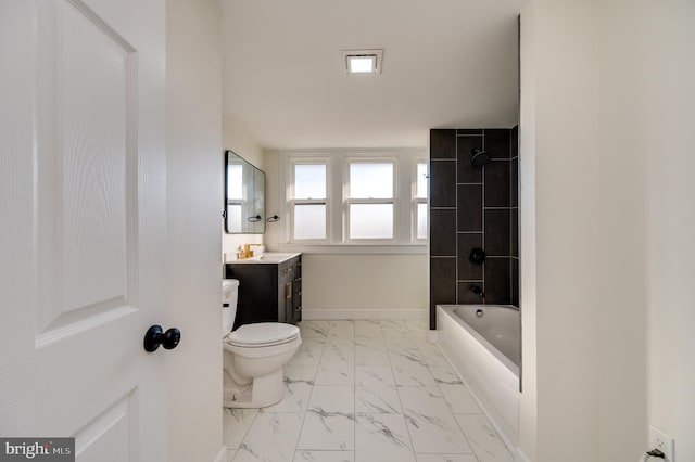 full bathroom with tiled shower / bath combo, toilet, and vanity