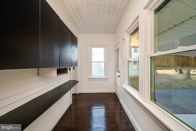 hall with dark hardwood / wood-style floors and wood ceiling