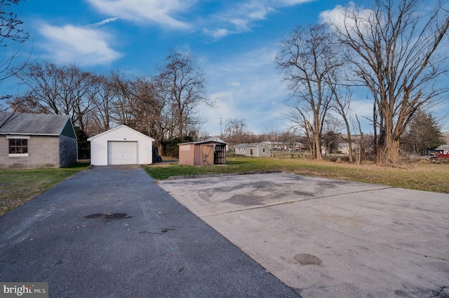 exterior space featuring a shed and a garage