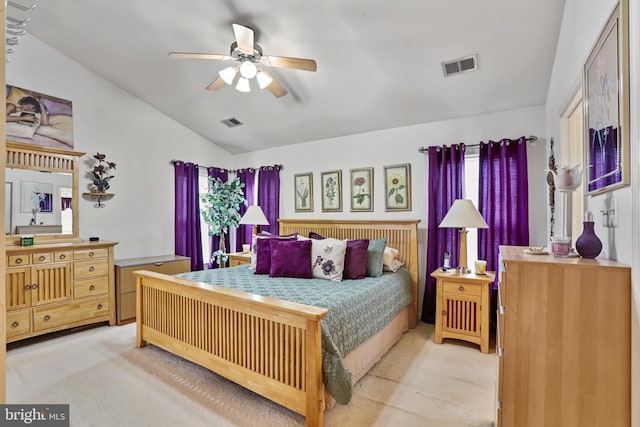 bedroom featuring light colored carpet, multiple windows, and lofted ceiling