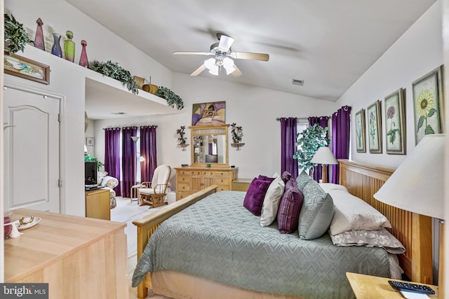 bedroom featuring ceiling fan and vaulted ceiling