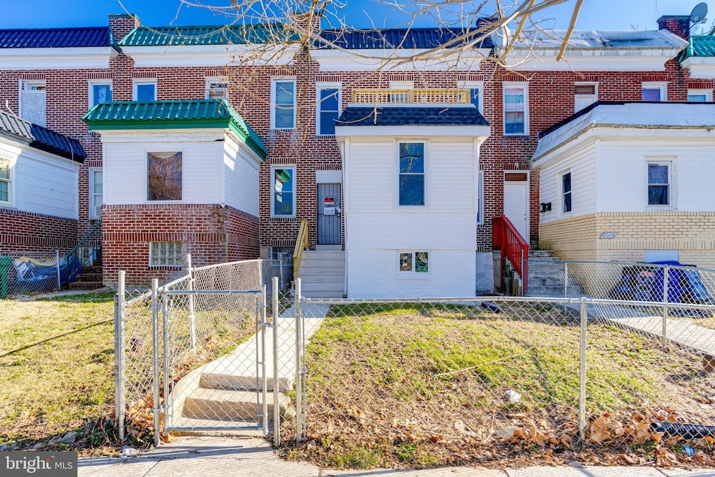 3007 Oakley Ave, Baltimore, MD 21215 - townhome / multi-family property with a front yard
