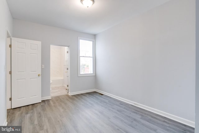 unfurnished room featuring light hardwood / wood-style flooring