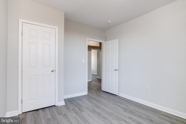 unfurnished bedroom featuring light hardwood / wood-style floors