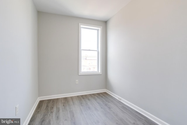 unfurnished room with light hardwood / wood-style floors