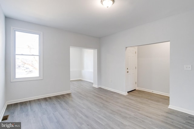 unfurnished room featuring light wood-type flooring