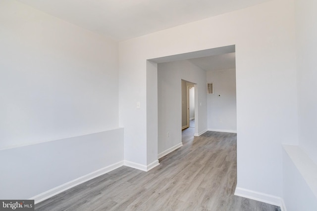 unfurnished room with light hardwood / wood-style flooring