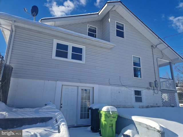 view of snow covered house