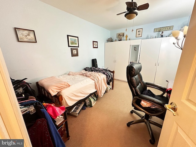 carpeted bedroom with ceiling fan