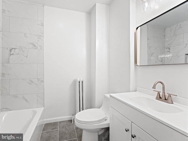 full bathroom with tile patterned floors, tiled shower / bath, vanity, and toilet