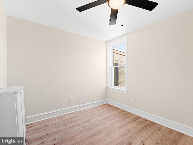 spare room with light hardwood / wood-style floors and ceiling fan