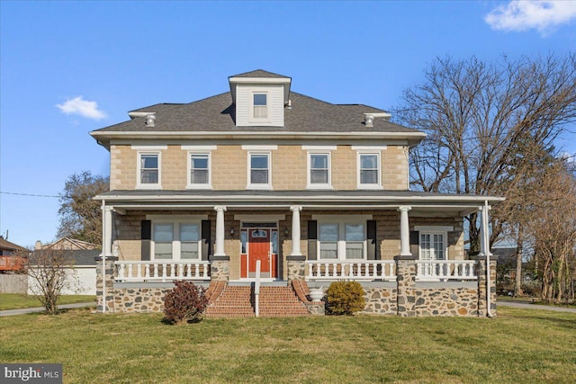 view of front of house featuring a porch and a front yard