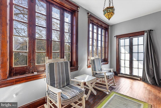 living area with hardwood / wood-style flooring