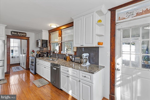 kitchen with white cabinetry, plenty of natural light, and appliances with stainless steel finishes