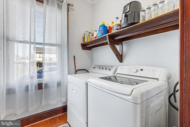 washroom featuring washer and dryer and hardwood / wood-style floors