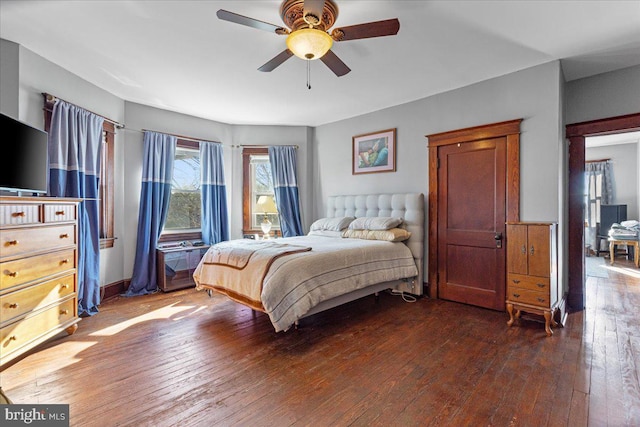 bedroom featuring ceiling fan and dark hardwood / wood-style flooring