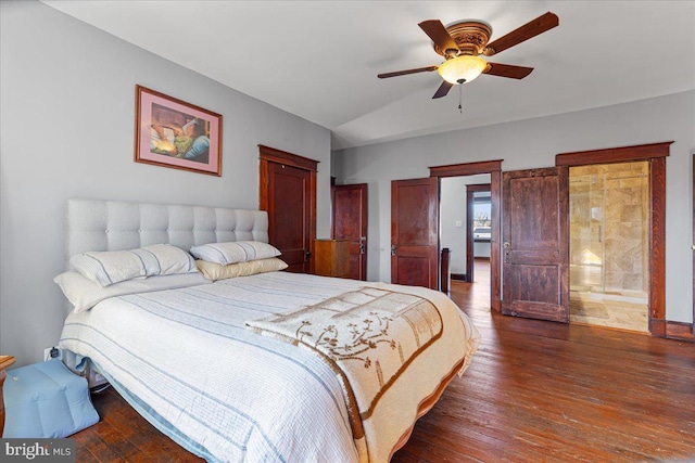 bedroom with vaulted ceiling, ceiling fan, and dark wood-type flooring