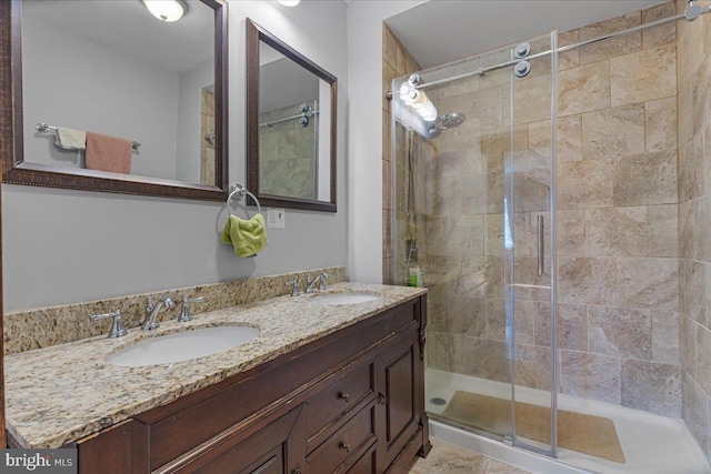 bathroom featuring vanity and an enclosed shower