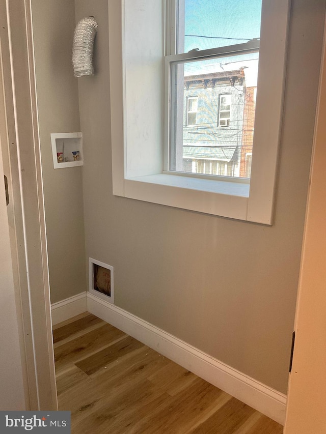 washroom featuring hardwood / wood-style floors and hookup for a washing machine