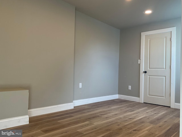 spare room featuring hardwood / wood-style flooring