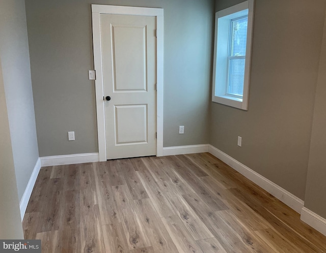 unfurnished room featuring light hardwood / wood-style floors