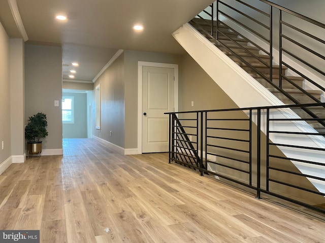 additional living space with light hardwood / wood-style flooring