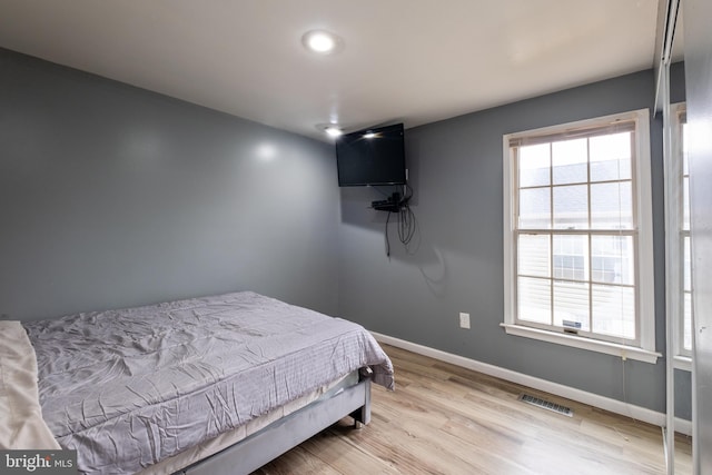 bedroom with light hardwood / wood-style floors