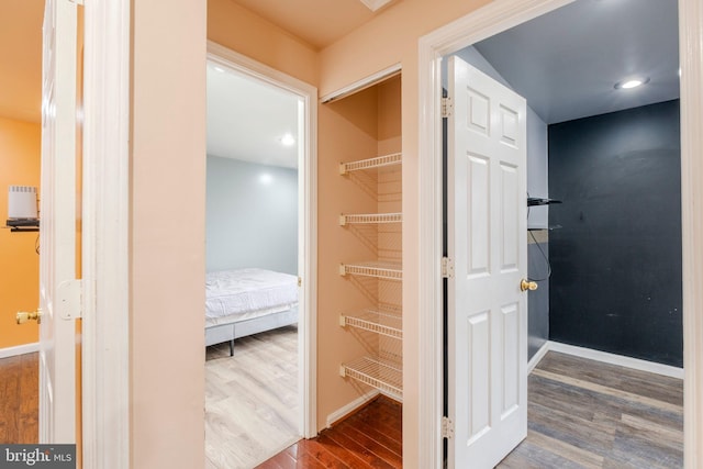 interior space with hardwood / wood-style floors and radiator heating unit