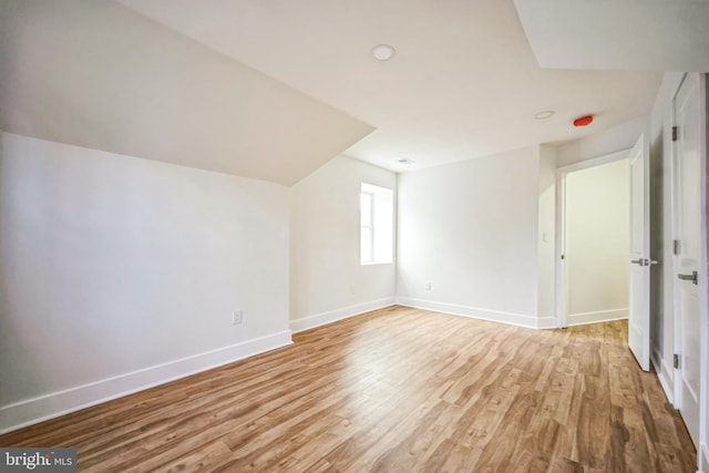 bonus room with light hardwood / wood-style flooring