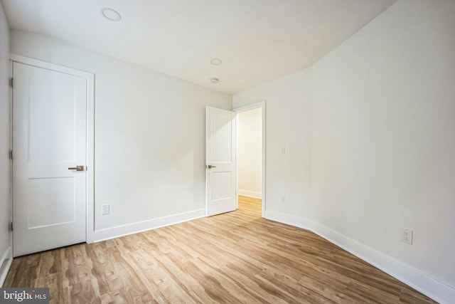 unfurnished room with light hardwood / wood-style floors