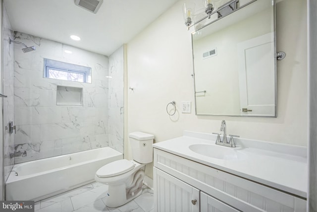 full bathroom featuring vanity, toilet, and tiled shower / bath combo