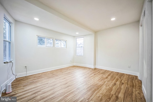 empty room with light hardwood / wood-style floors