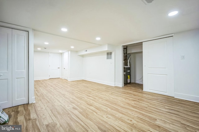 basement with light wood-type flooring