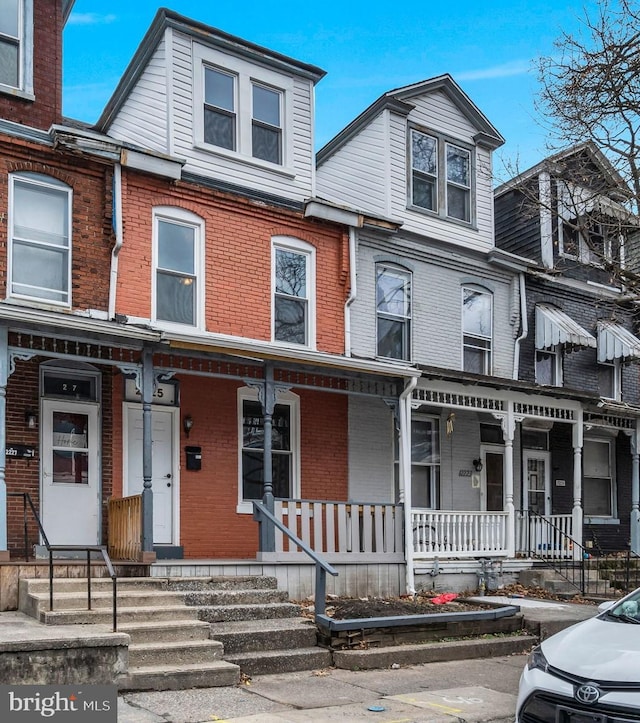 multi unit property featuring a porch