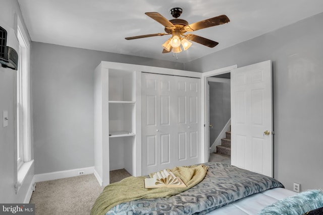 bedroom featuring multiple windows, carpet floors, a closet, and ceiling fan