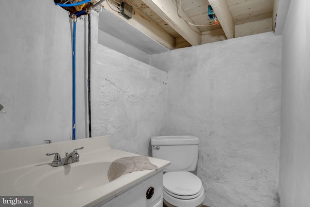 bathroom featuring sink and toilet