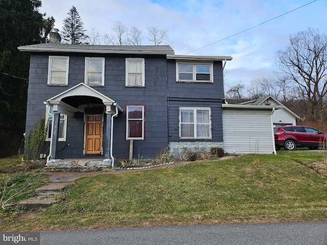 view of front of property with a front lawn