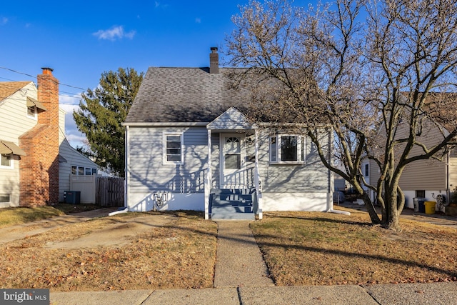 bungalow-style house featuring central air condition unit