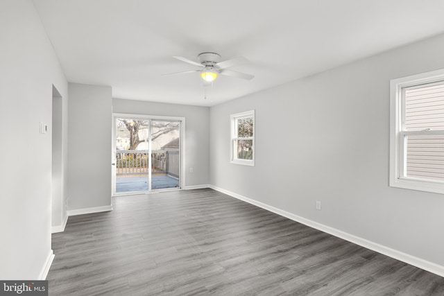 unfurnished room featuring ceiling fan and hardwood / wood-style floors