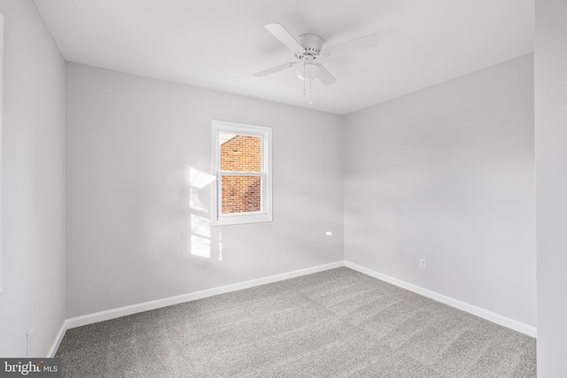 empty room with carpet flooring and ceiling fan