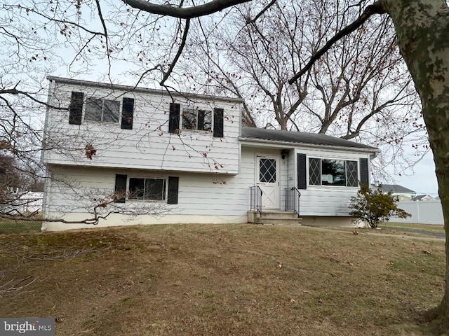 tri-level home featuring a front yard