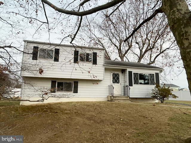 split level home with a front yard