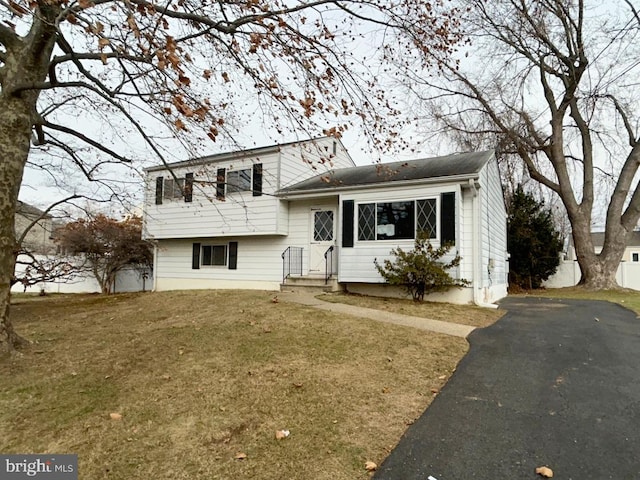 split level home with a front yard