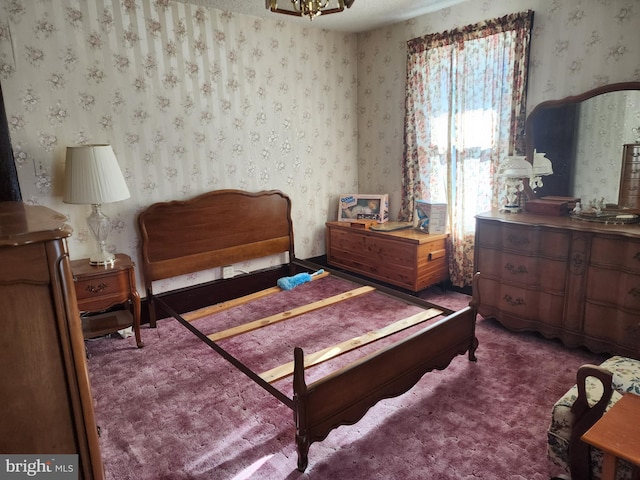 bedroom featuring dark colored carpet