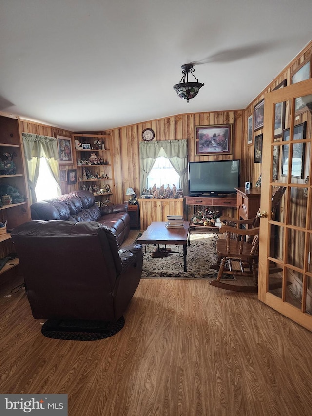 living room with wooden walls