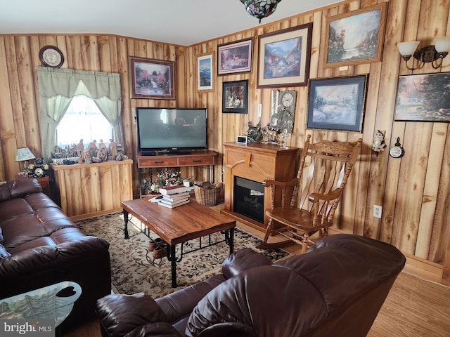 living room featuring wood walls