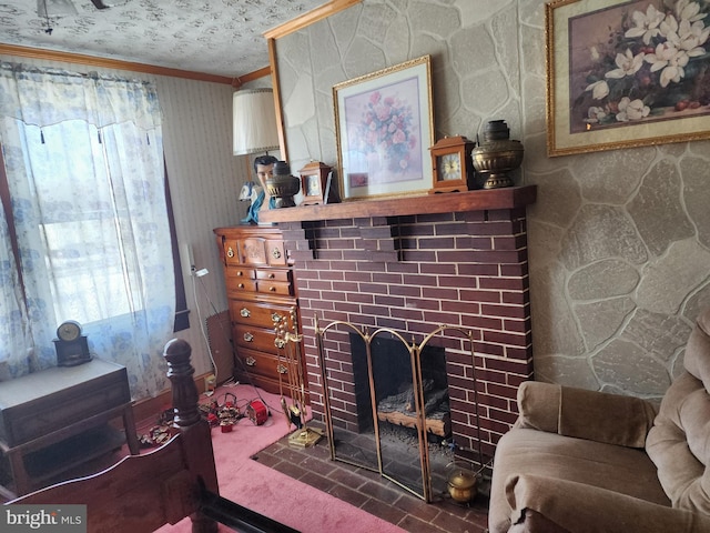 carpeted living room with a textured ceiling, a stone fireplace, and ornamental molding