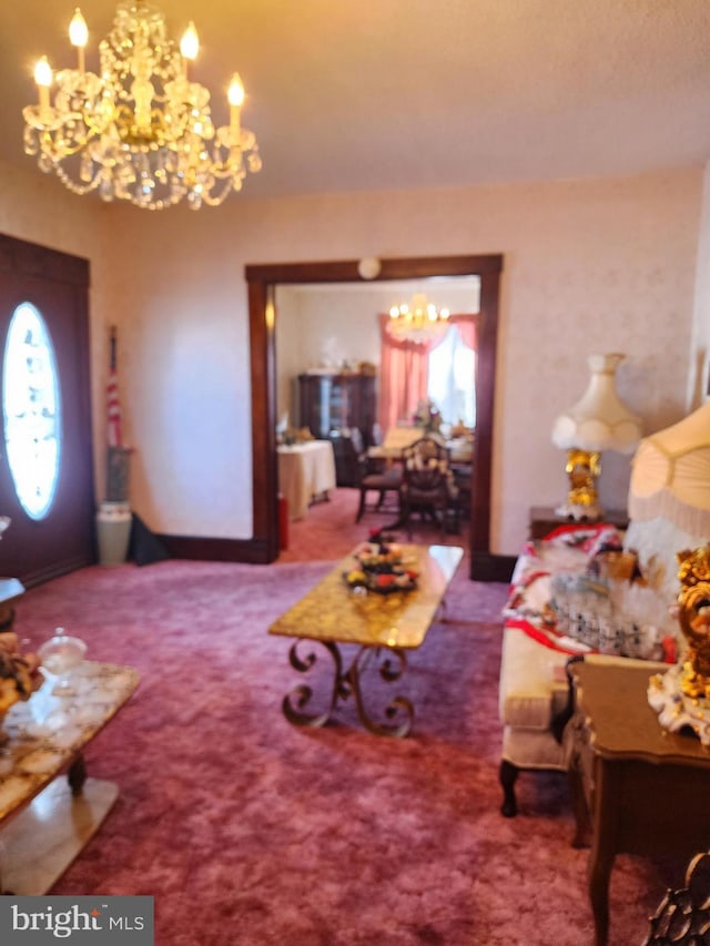 living room with carpet floors and a notable chandelier