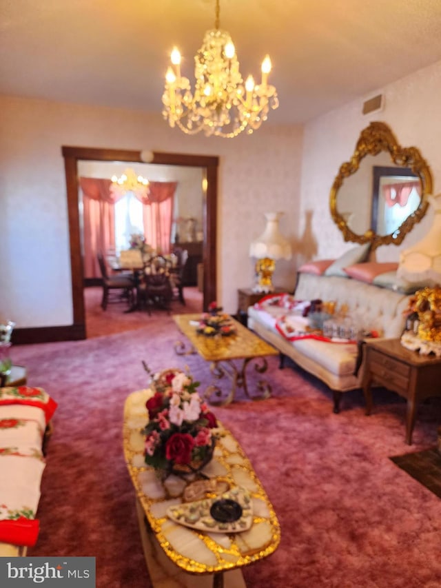 carpeted living room featuring a notable chandelier