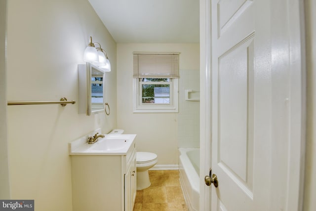 bathroom featuring tile patterned floors, vanity, and toilet